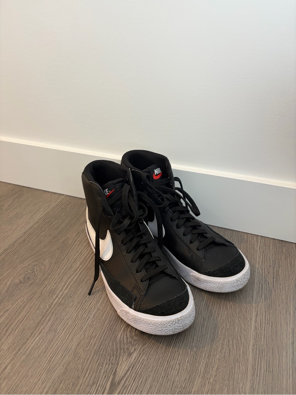 Nike Black & White Mid-Top Sneakers with Red Logo Accent
